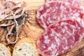 Sliced salami on a wood board Royalty Free Stock Photo