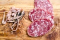 Sliced salami on a wood board Royalty Free Stock Photo