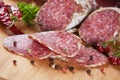 Sliced salami on wooden board Royalty Free Stock Photo