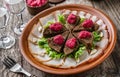 Sliced salted lard and bacon with rye bread, horseradish, spices on a rustic wooden background with vodka. Appetizer, close up