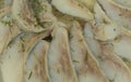 Sliced salted and pickled herring fish texture background. Salted herring in oil Royalty Free Stock Photo