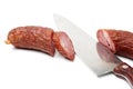 Sliced sausage and kitchen knife Royalty Free Stock Photo