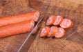 Sliced sausage on an oak board sharp. Kitchen knife