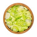 Sliced fresh scallions, chopped bulbs of green onions, in a wooden bowl Royalty Free Stock Photo