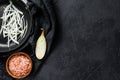 Sliced shallot in a pan, cooking fried onions. Black background. Top view. Space for text Royalty Free Stock Photo