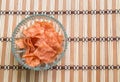 Sliced sheets of dried and crispy pork in bowl on wooden background Royalty Free Stock Photo