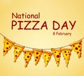 sliced slices of pizza on a yellow background hung on a rope with the inscription Pizza day