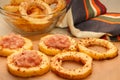 Sliced slices from zucchini, filled with minced meat, on food paper