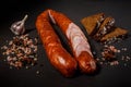 sliced smoked dry cured sausage with chili and rye bread Royalty Free Stock Photo