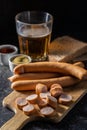 Sliced smoked frankfurter sausages on cutting board Royalty Free Stock Photo