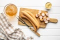 Sliced smoked frankfurter sausages on cutting board Royalty Free Stock Photo