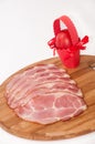 Sliced smoked ham and red easter egg Royalty Free Stock Photo