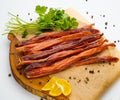 Sliced smoked salmon belly with fresh parsley. Isolated over white background Royalty Free Stock Photo