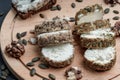 Sliced soft cheese with seeds on the surface and spices Royalty Free Stock Photo