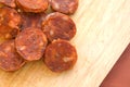 Sliced spanish chorizo sausage on rustic board