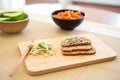sliced sprouted bread on a bamboo board Royalty Free Stock Photo