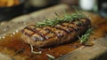 Sliced Steak on Cutting Board With Rosemary Sprig Royalty Free Stock Photo