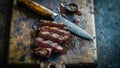 Sliced steak on rustic cutting board with knife