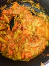 Sliced stewed vegetables close-up, vertical food background