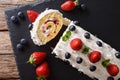 Sliced strawberry cake with whipped cream, mint and blueberries Royalty Free Stock Photo