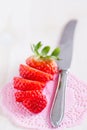 Sliced strawberry and knife Royalty Free Stock Photo