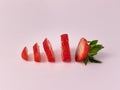 Sliced strawberry on pink background Royalty Free Stock Photo