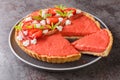 Sliced strawberry and rhubarb tart decorated with mint and whipped cream close-up on a plate. Horizontal Royalty Free Stock Photo