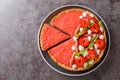 Sliced strawberry and rhubarb tart decorated with mint and whipped cream close-up on a plate. Horizontal top view Royalty Free Stock Photo