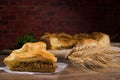 Sliced succulent meat pie with mushrooms and meat