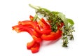 Sliced sweet bell pepper, aromatic herbs tarragon and thyme, close-up on a white background, isolate, copy space Royalty Free Stock Photo