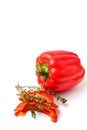 Sliced sweet bell pepper with thyme branches close-up on a white background, isolate, copy space Royalty Free Stock Photo