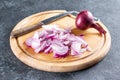Sliced sweet onions for a savory salad with bell peppers, carrots, vegetables and sesame seeds. Step by step recipe Royalty Free Stock Photo