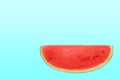 Sliced sweet watermelon isolated over cyan background with copy space Royalty Free Stock Photo