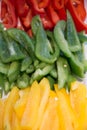 Sliced three color green red yellow peppers Royalty Free Stock Photo