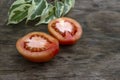 Sliced tomato with leaf