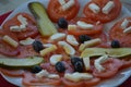 Sliced tomatoes with cheese and olives and cucumber and eggs in slice with salt kristalls