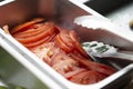 Sliced tomatoes in iron bowl Royalty Free Stock Photo