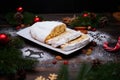 Sliced Traditional Christmas stollen cake with marzipan and dried fruit on wooden background Royalty Free Stock Photo