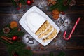 Sliced Traditional Christmas stollen cake with marzipan and dried fruit on wooden background Royalty Free Stock Photo