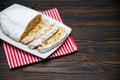 Sliced Traditional Christmas stollen cake with marzipan and dried fruit on wooden background Royalty Free Stock Photo