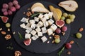 Sliced Traditional Italian Gorgonzola cheese on stone seving board