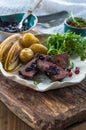 Sliced venison steak dinner Royalty Free Stock Photo
