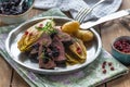 Sliced venison steak dinner