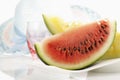 Sliced Water melon in front of straw hat Royalty Free Stock Photo