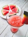 Sliced Watermelon on white plate with spoon and fork stock photo with white background.