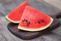 Sliced watermelon on wooden cutting board background / Close up fresh watermelon pieces tropical summer fruit Royalty Free Stock Photo