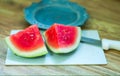 Sliced watermelons and white cutting board