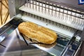 Sliced bread in cutting machine Royalty Free Stock Photo
