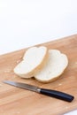 Sliced white bread and knife on the cutting board Royalty Free Stock Photo