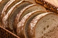 Sliced white bread with wheat flour on a wooden table. Chamado PÃÂ£o de forma